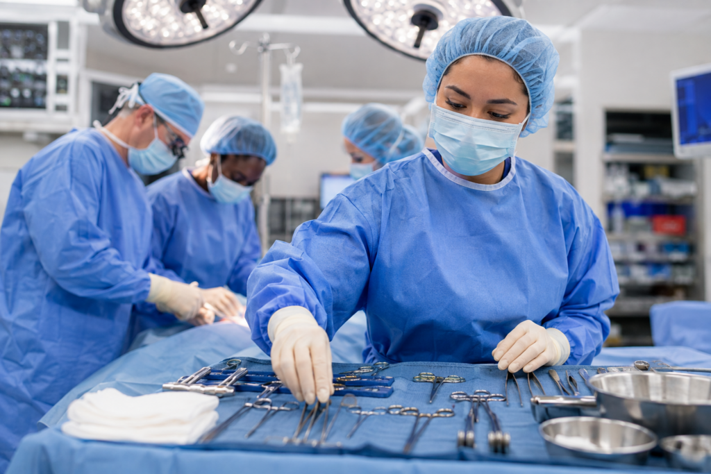 Stautzenberger surgical technology student learning instrument prep for surgical teams in an operating room lab